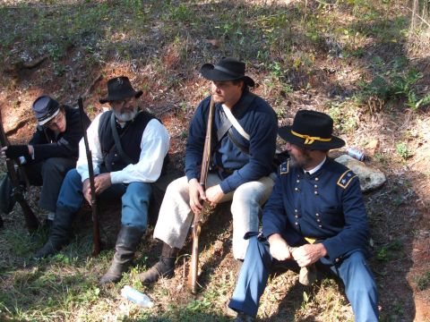 1966 Ford Ranchero - Men in historical costumes rest outdoors, with rifles and period hats visible.