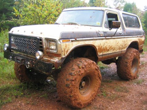 1992 Ford Mustang - This heavily modified 1978 Ford Bronco is covered in mud after off-roading.