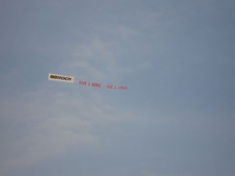 1994 Ford Bronco - A banner is towed through the sky with a message from 98ROCK.