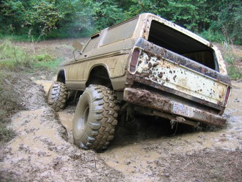 1992 Ford Mustang - This vehicle is stuck in the mud, with its rear end angled down in a rut.