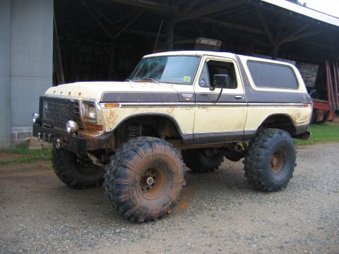 1992 Ford Mustang - This lifted 1978 Ford Bronco features large mud tires and a two-tone paint scheme.