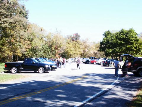 2001 Mercury Grand Marquis - A sunny day at a picnic with many vehicles parked in a lot.