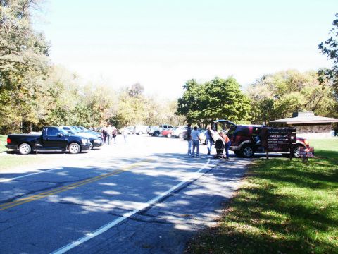 2001 Mercury Grand Marquis - A gathering of vehicles and people in a park setting, with a picnic shelter visible in the distance.