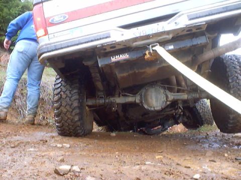 1976 Ford F-100 - Underneath view of a 1976 Ford F-100 showing its rear axle and suspension system.