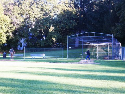 2001 Mercury Grand Marquis - A baseball field scene with a batting cage and players.