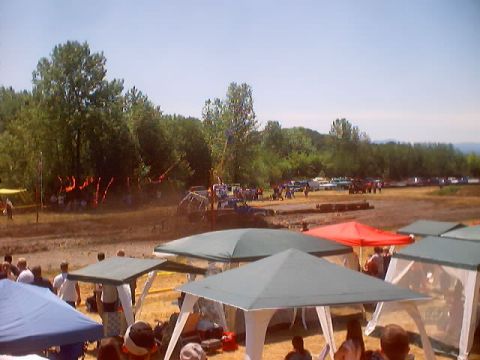 1976 Ford F-100 - Scene from a mud bog event in 2003, showing tents and various vehicles.