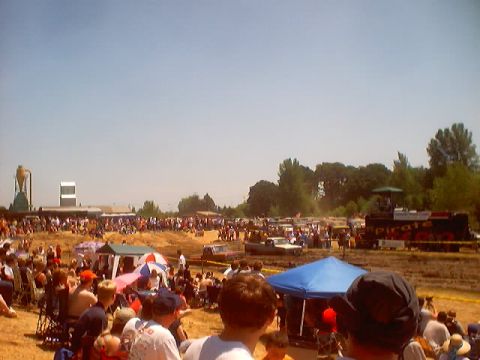 1976 Ford F-100 - Mud bogging event with many spectators and vehicles in the background.