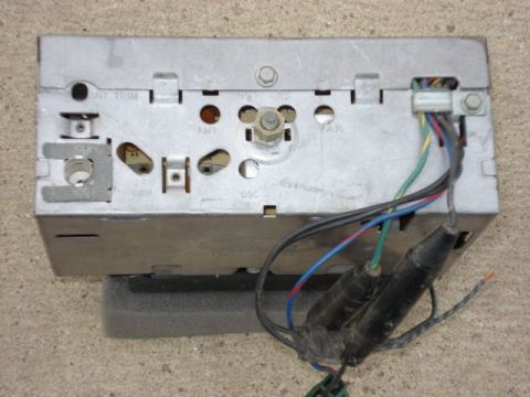 1979 Ford Bronco - Rear view of an old car radio, showing connections and some labeling.