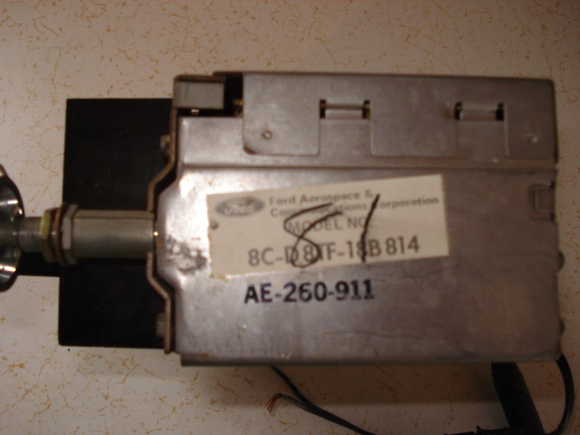 Ford radio module with label showing model number 8C-18B814 and AE-260-911