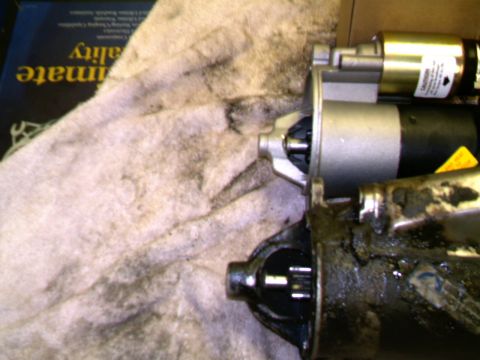 1987 Ford Bronco II - Comparing a worn starter motor with a new replacement part.