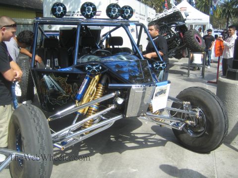 1990 Ford Bronco - tube-frame off-road buggy with airbrushed bodywork, gold coilovers, polished chrome suspension arms and a roof light bar is displayed as on…