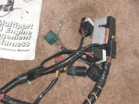 1991 Ford Bronco - Engine wiring harness and installation manual for a multiport fuel injection system are shown.