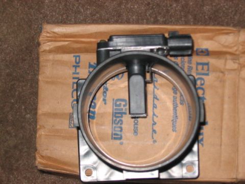 1991 Ford Bronco - Mass air flow sensor part shown on a cardboard box with brand markings.