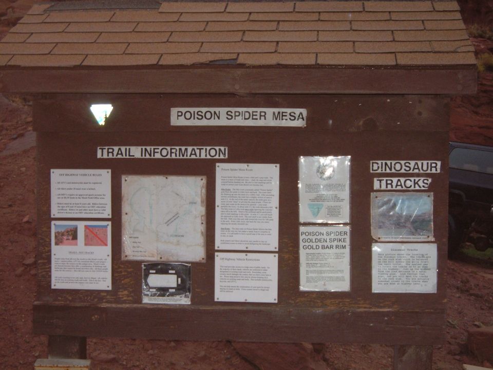 Trail information kiosk with maps and text at Poison Spider Mesa