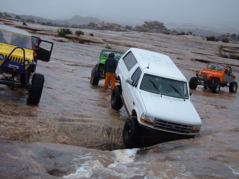 1993 Ford Bronco - Off-roading in Moab: a 1993 Ford Bronco tackles a challenging rock formation.