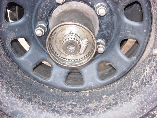 Close-up of a wheel hub with lug nuts