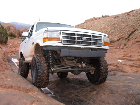 1993 Ford Bronco - This modified Ford Bronco navigates a rocky trail, its off-road capabilities.