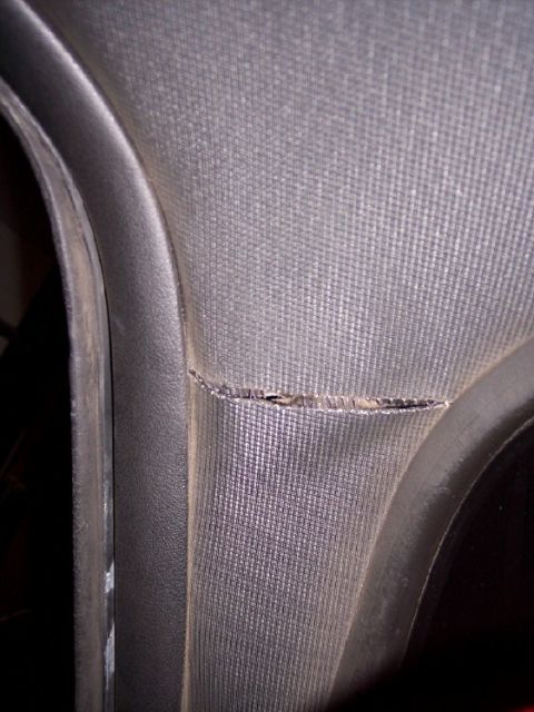 1972 Ford Ranchero - Interior trim panel shows damage with a visible tear in the fabric.