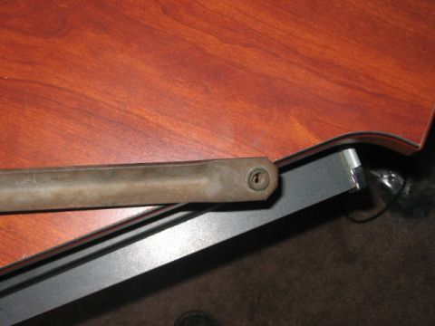 1991 Ford Bronco - Close-up of a metal rod a keyhole mechanism.