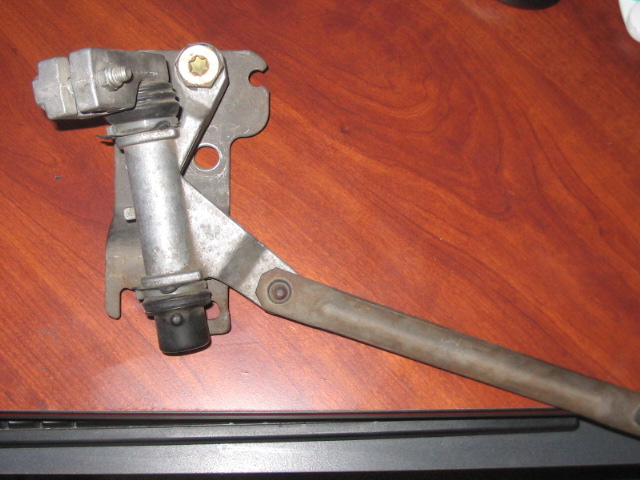 windshield wiper linkage assembly with metal arm and bracket