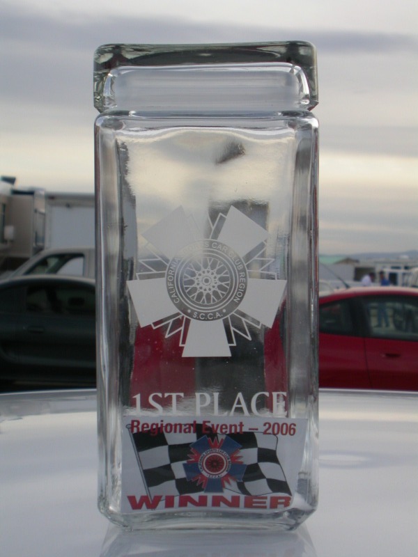Clear glass 1st Place 2006 winner trophy sitting outdoors
