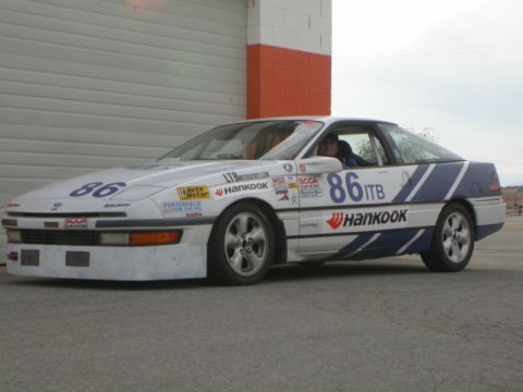 1990 Ford Probe - This race car, marked with number 86, features Hankook branding and various sponsor decals.
