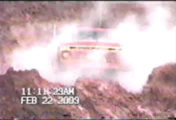1976 Ford F-100 - A truck is seen kicking up a large dust cloud, with a timestamp indicating the event occurred on February 22, 2009.