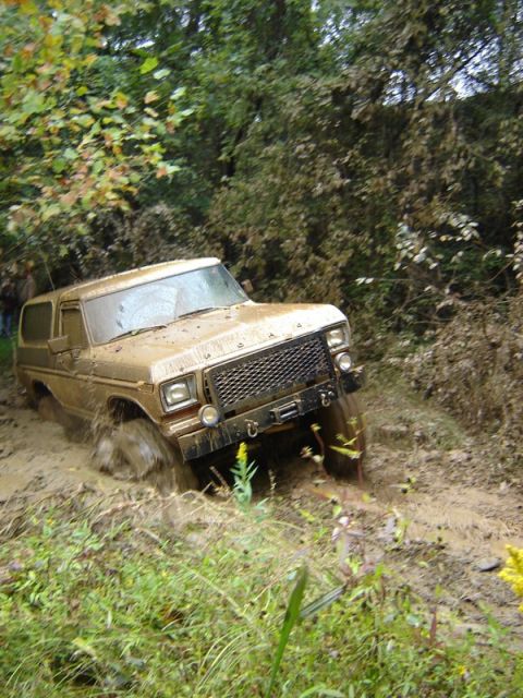 1992 Ford Mustang - This 1978 Ford Bronco is navigating a muddy off-road trail.