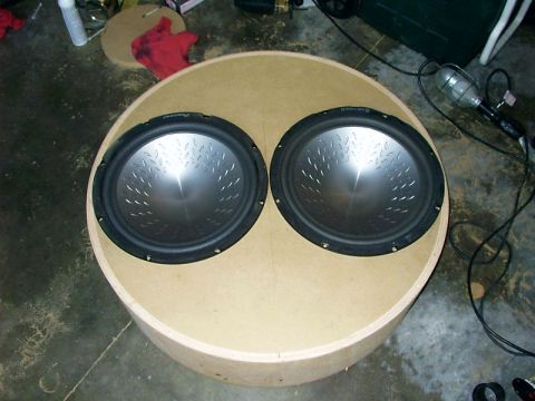 2000 Ford Excursion - A pair of car subwoofers are installed in a custom-built circular enclosure.