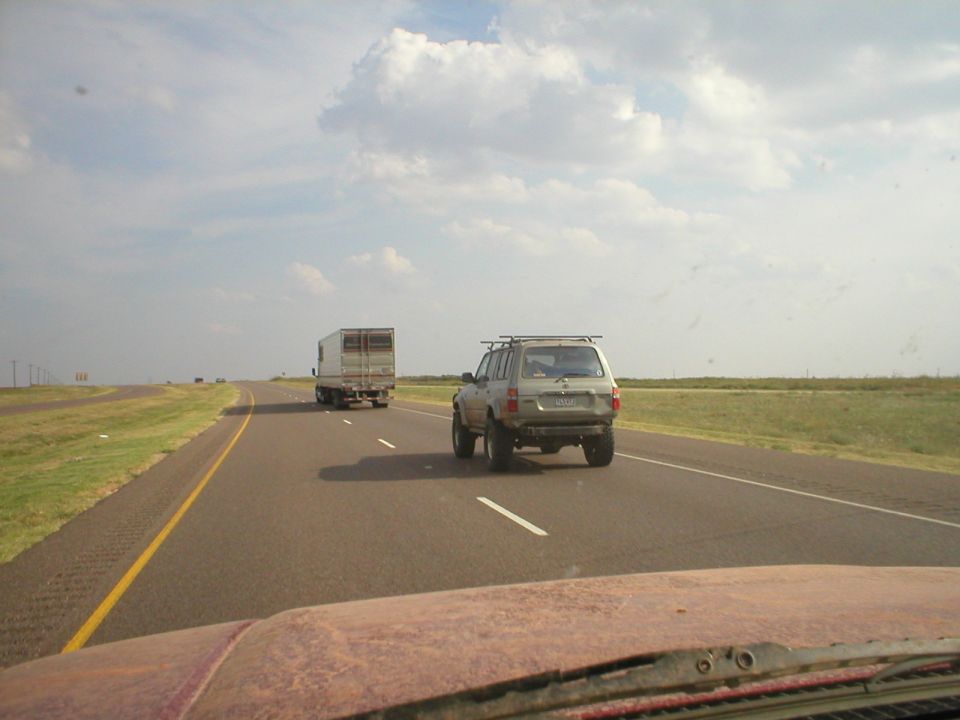 Silver 1996 Toyota 4Runner on highway, rear view