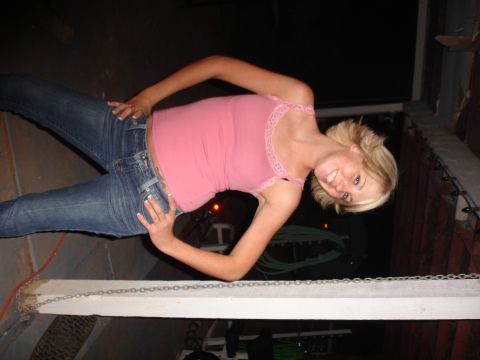 1984 Ford Bronco - A woman in a pink top and blue jeans poses for a photo.