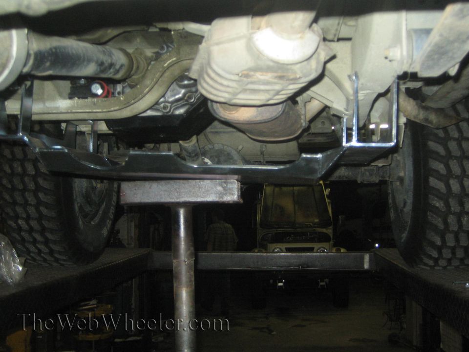 1987 Suzuki Samurai underbody with skid plate, exhaust, and tires visible