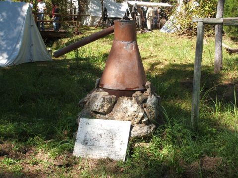 1966 Ford Ranchero - A historical reenactment scene shows a copper pot still apparatus with informational signage.
