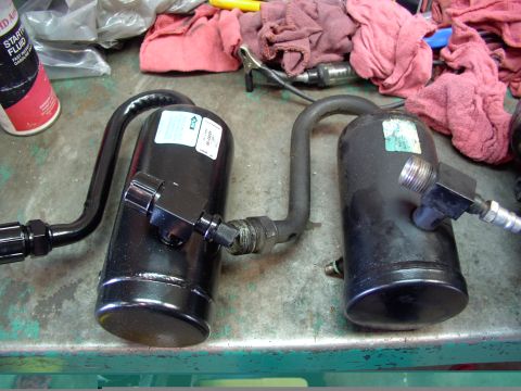 1988 Ford C-350 (Centurion Conversions) - Two black air conditioning receiver-driers are shown, likely for a vehicle's AC system.