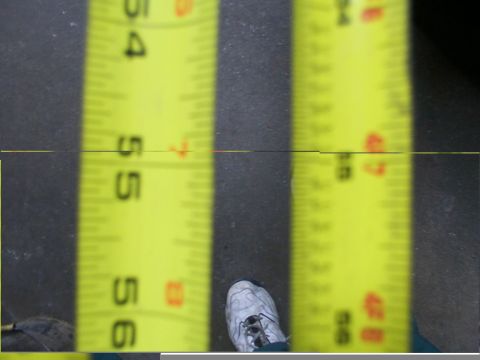1988 Ford C-350 (Centurion Conversions) - A measuring tape is shown with numbers 54, 55, and 56 visible, along with a person's shoe.