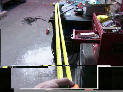 1988 Ford C-350 (Centurion Conversions) - Tools of the trade: tape measures and a toolbox in a workshop setting.