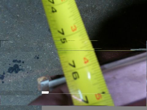 1988 Ford C-350 (Centurion Conversions) - A close-up shot shows a yellow measuring tape with inch markings, indicating a measurement is being taken.