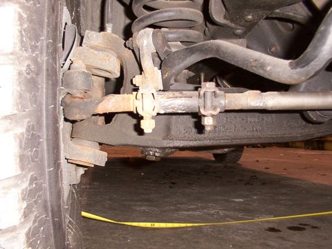 1988 Ford C-350 (Centurion Conversions) - Front suspension steering linkage components are visible in this close-up shot.