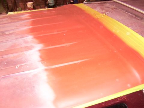 1988 Ford C-350 (Centurion Conversions) - A vehicle roof is being prepped for paint, showing primer and masking tape.