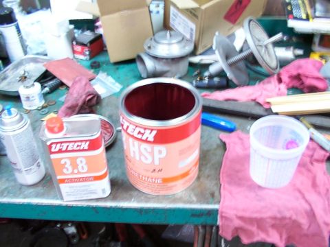 1988 Ford C-350 (Centurion Conversions) - Workbench with paint supplies, including U-Tech activator and a can of HSP polyurethane.