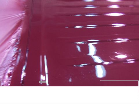 1988 Ford C-350 (Centurion Conversions) - Detail of the red paintwork, showing reflections and texture.