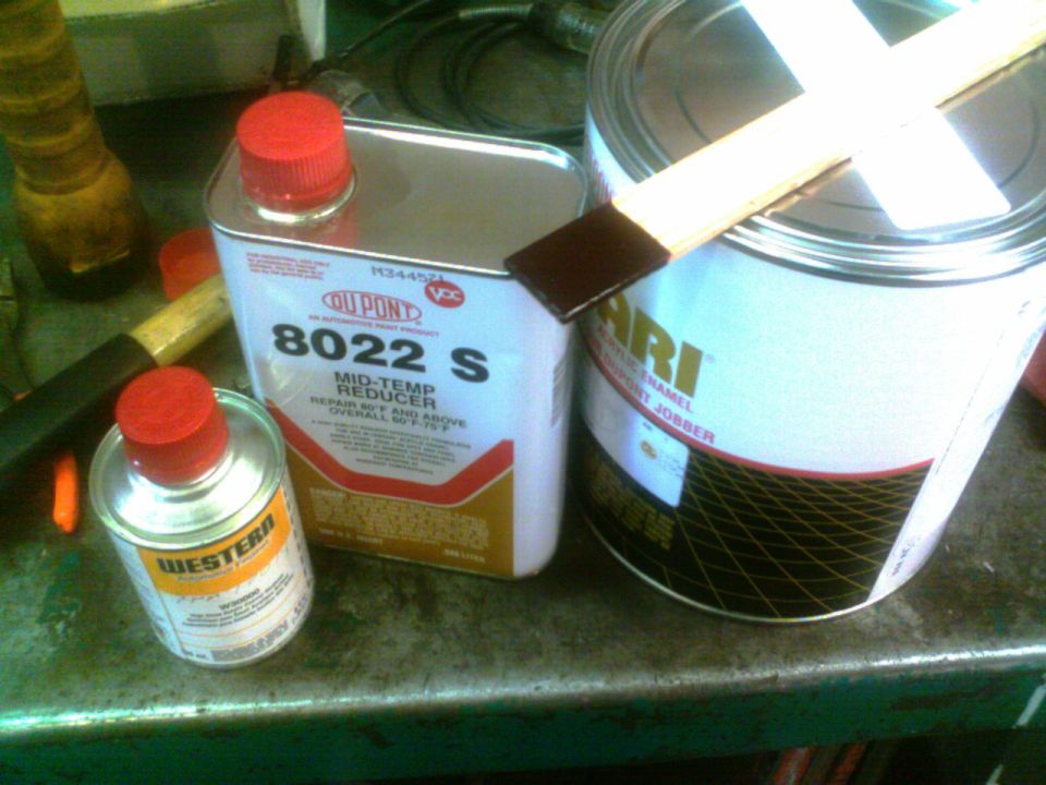 Paint cans and reducer on a metal surface. Dupont 8022 S Mid-Temp Reducer and Western can