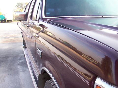 1988 Ford C-350 (Centurion Conversions) - Side view of a 1988 Ford C-350 (Centurion Conversions) showing the fender, door, and hood.