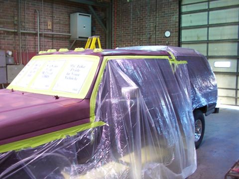 1988 Ford C-350 (Centurion Conversions) - Vehicle being prepped for paint, covered in plastic and tape. Text on window visible.