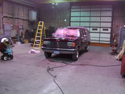 1988 Ford C-350 (Centurion Conversions) - Ford F-Series truck in a garage, possibly undergoing paint work.