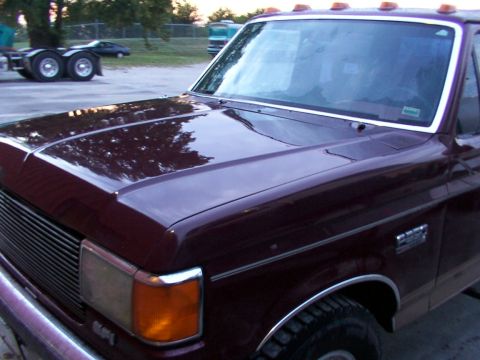 1988 Ford C-350 (Centurion Conversions) - Front view of a 1988 Ford C-350 (Centurion Conversions) pickup truck, showing the fender and hood.
