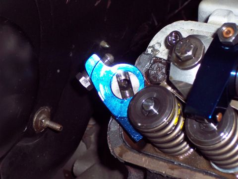 1963 Ford Galaxie - A close-up view of engine components, focusing on a blue rocker arm and valve springs.