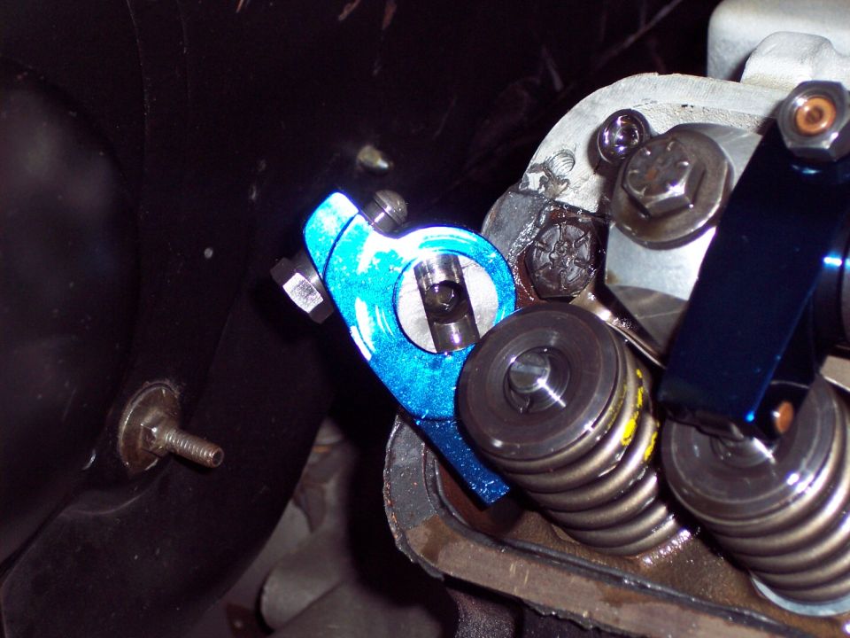 Close-up of a blue aftermarket rocker arm on an engine valve train
