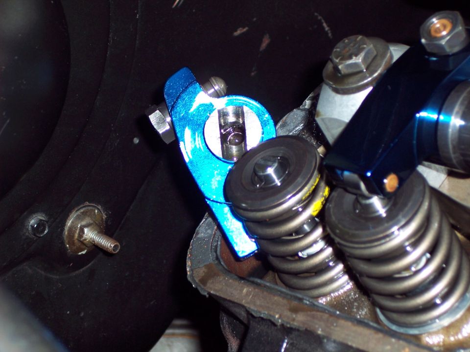 Blue aftermarket rocker arm assembly with springs and bolts
