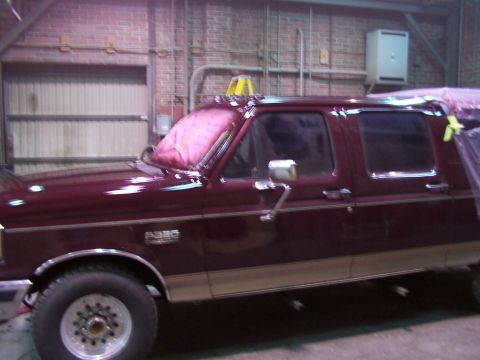 1988 Ford C-350 (Centurion Conversions) - Maroon 1988 Ford C-350 (Centurion Conversions) pickup truck with tan lower body trim, seen from the side.